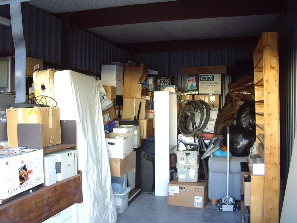 Boxes, shelves, old office equipment, storage unit