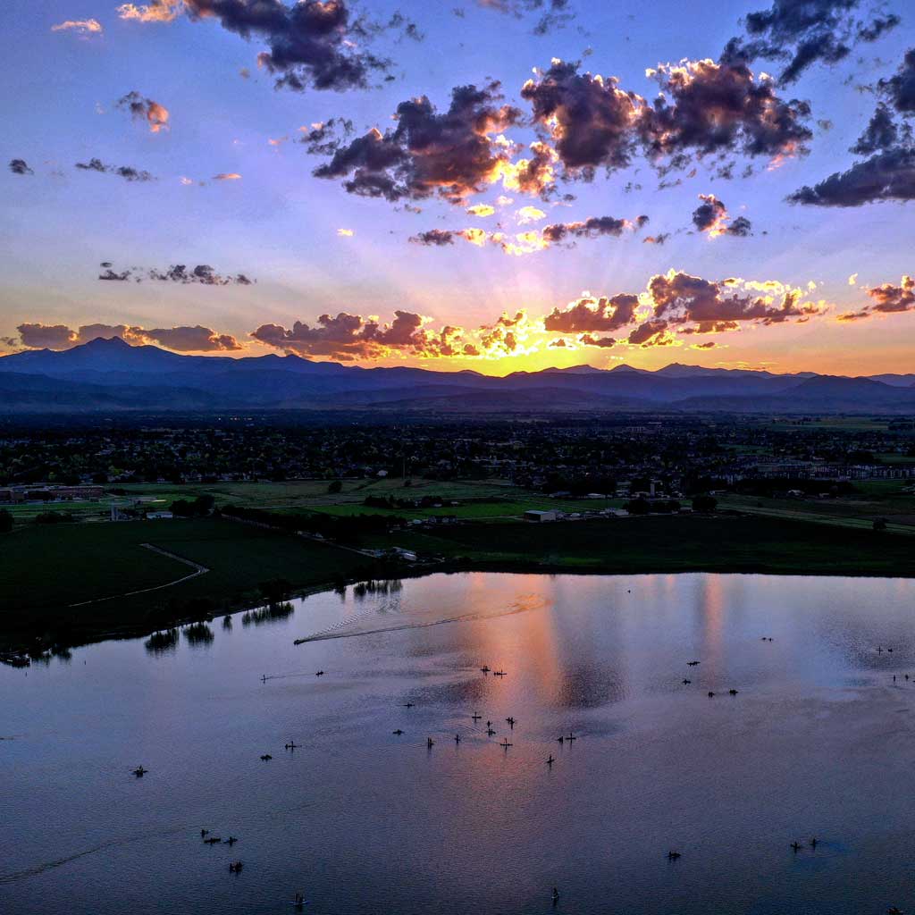 Lake with mountains in the background at sunset, Frederick junk removal