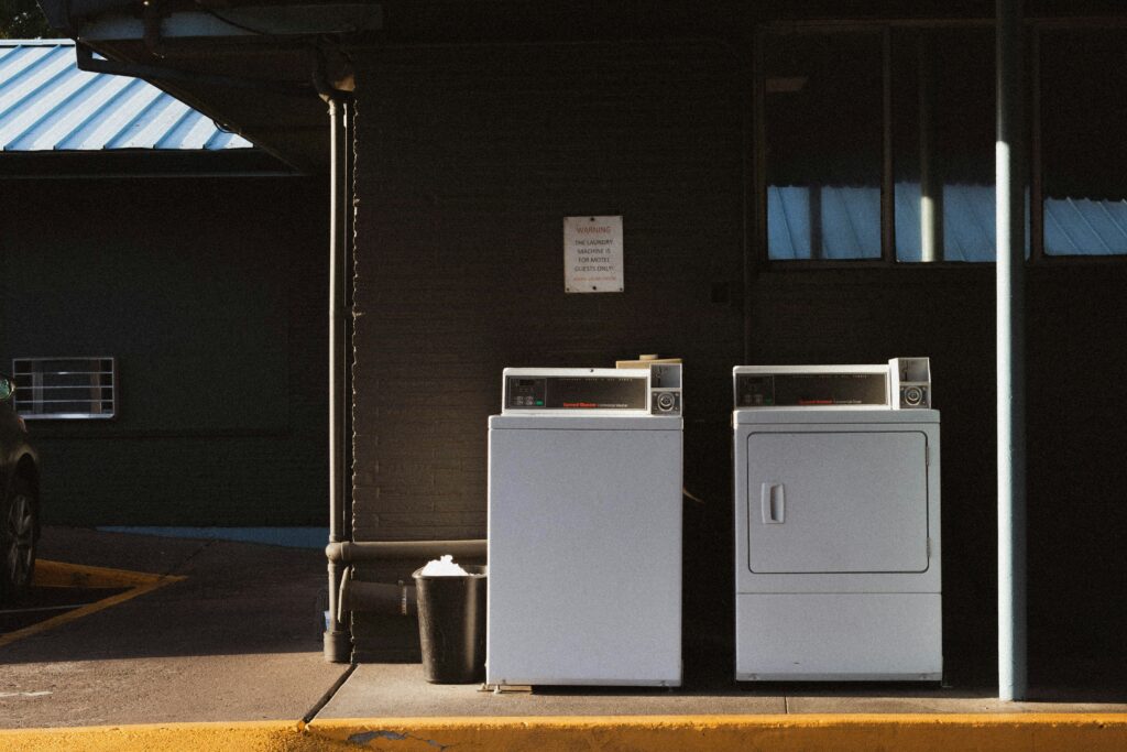 washer and dryer waiting to be removed and disposed, appliance disposal